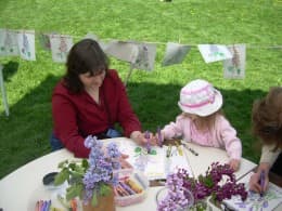 Mother and Daughter coloring  together on Lilac Sunday at the Arnold Arboretum