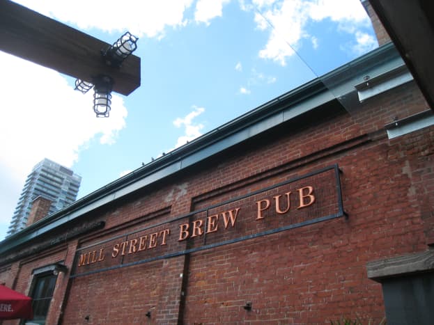 The Mill Street Brew Pub sign, right outside of the restaurant, close to the entry.