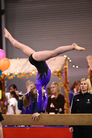 Back Walkover on Beam at a Level 6 Gymnastics Competition (1/4)