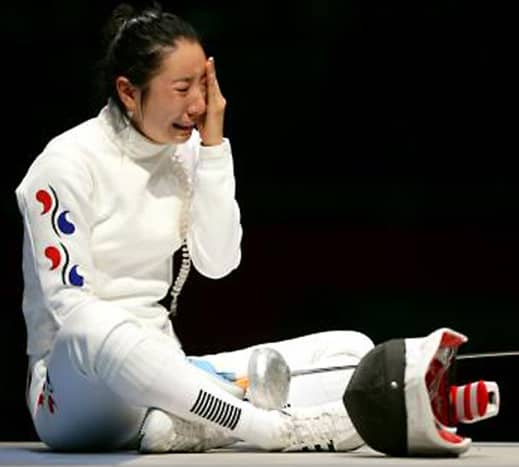 South Korea's Shin A-Lam in floods of tears after a purely technical infringement led to her disqualification in a fencing contest.