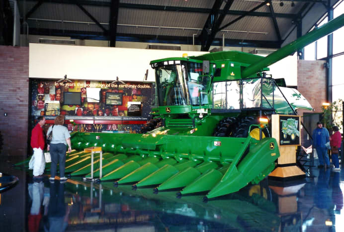 Harvesting equipment on display in the John Deere Pavilion