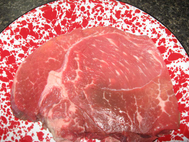 Trim fat from steak.