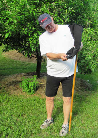 My dad, a Frugal Engineer, displays his apple picker made out of a leg of jogging pants that had a hole in them.  And he is wearing the pants as cut-offs.