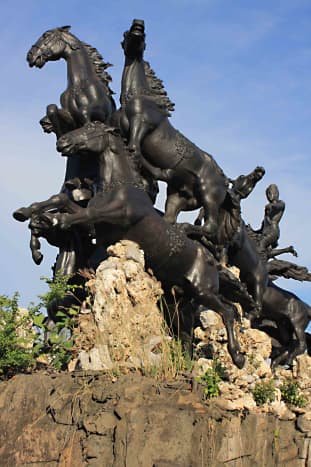 A 'Chariot of the Gods' drawn by horses riding through the sky - an impressive statue
