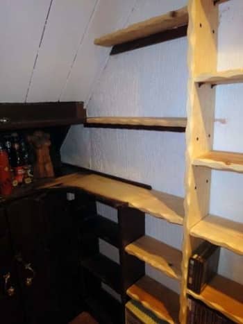 Two replacement wall shelves, test fitted with the other shelving positioned.