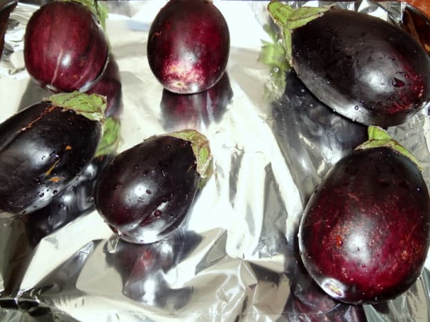 Place eggplants on foil lined baking sheet