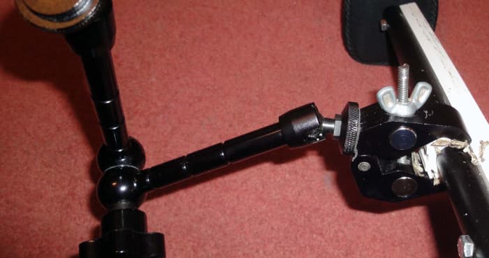 An 11 inch articulating magic arm and support clamp for attaching additional camera equipment e.g. 7 inch LCD.