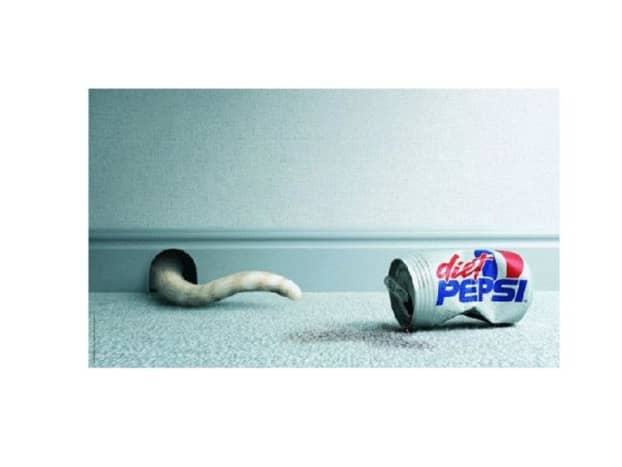 By drinking Diet Pepsi, this cat slimmed down and was able to fit in the mouse hole