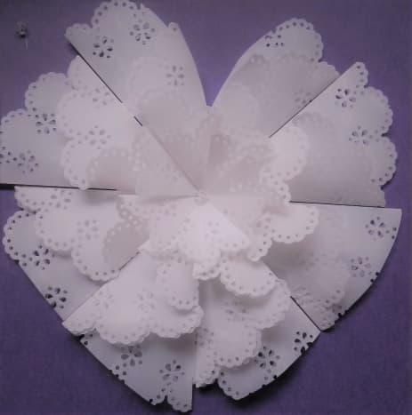 Use a circle doily punch and cut vellum rosette into a heart shape for Valentine's Day.  