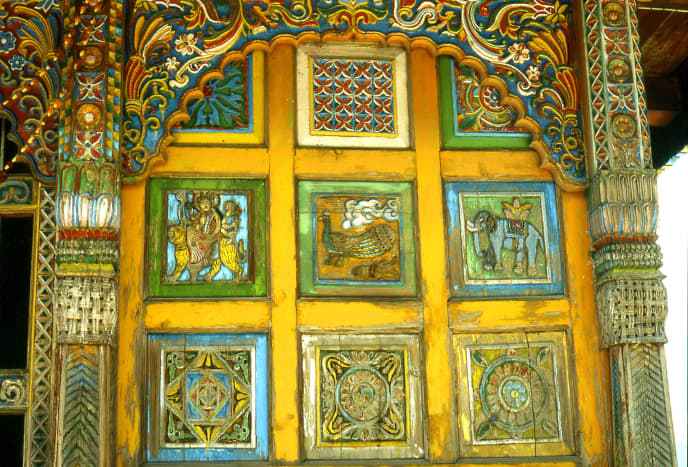 Paintings on a carved door