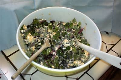 Now that you have a big enough bowl, toss the chard with the egg-cheese mixture like a salad until it appears most of the leaves are coated with the mixture.