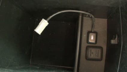 The Honda Civic's built-in iPod adapter is located at the bottom of the console.