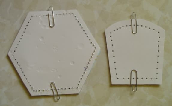Here are the side and bottom pieces paperclipped together, showing the lines and the holes.