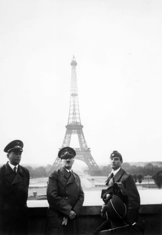Adolf Hitler in Paris summer of 1940 standing before the Eiffel Tower at the height of his power. It would be his only trip to Paris.