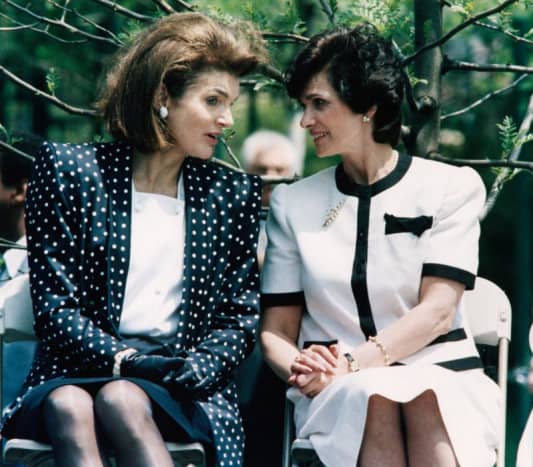 Jackie Kennedy and a friend - Jackie is wearing black gloves