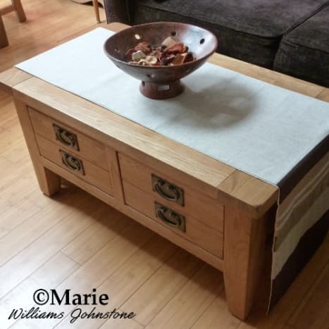 We choose a large oak coffee table with two big and deep drawers. One holds all my craft ribbons and the other has fabric.