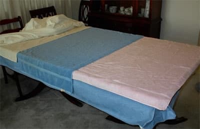 To prepare your tabletop or other flat surface (I have used a twin bed and done it for a day instead of overnight.),you will need some very thick and thirsty cotton towels. Put them on top of a waterproof table cover or vinyl tablecloth.  