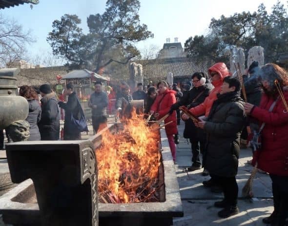 During Chinese New Year people like to visit a local temple and burn incense to greet the new year.  The incense burners can get really full at that time.
