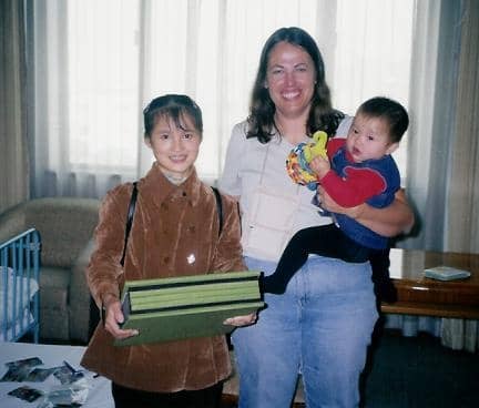 Adoption Day: Mrs. Lee, Mollie and Me right after I'd given her the scrapbook from the other Wuzhou adoptive parents.