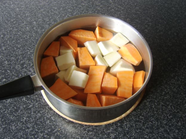 Sweet potatoes and parsnip prepared for boiling