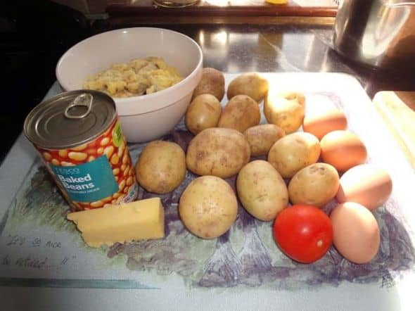 Basic ingredients for making Potato and Cauliflower Cheese Pie - Surplus Cauliflower Cheese, potatoes, tomatoes, eggs, cheese and baked beans.