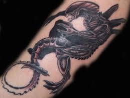 Aliens Tattoo - A dragon is a large, serpentine, legendary