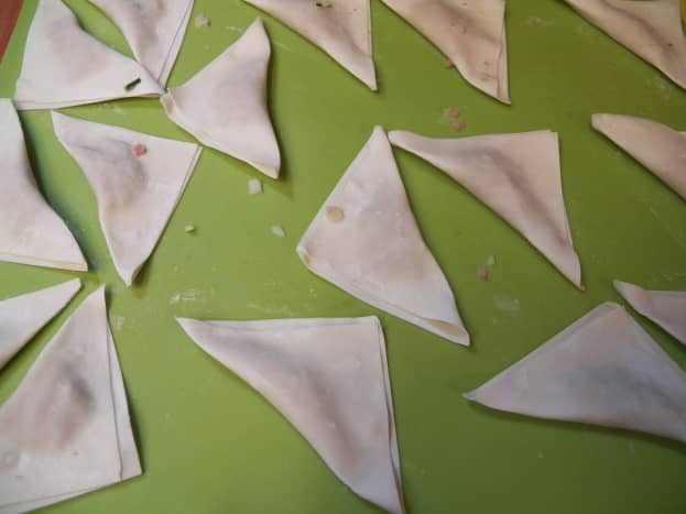Place potstickers or wontons on a pan or chopping board. Make sure they are not touching.