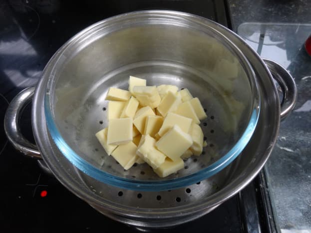 White chocolate for the filling being melted in the steamer