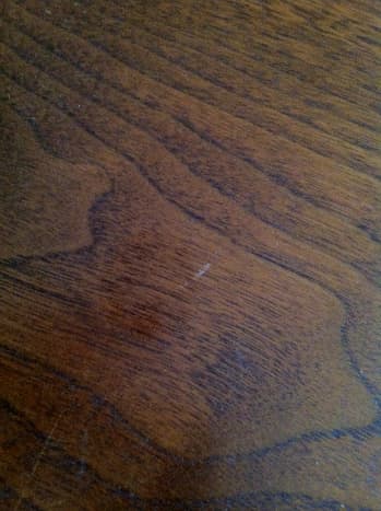A scratch on my 1960s vintage walnut Lane coffee table.