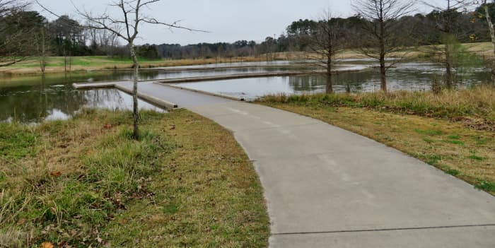 Approaching the raised boardwalk area over a pond in Keith-Wiess Park