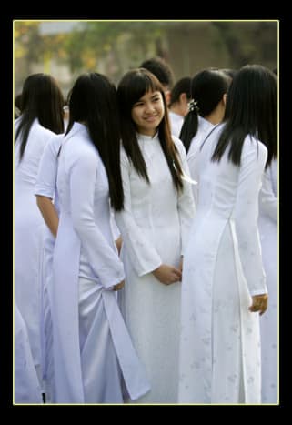 White ao dai as uniform for female student.