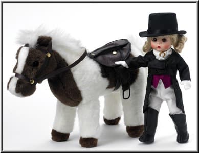 This Madame Alexander Girl is very elegant in her Equestrian long tail black coat, white pants, red vest, white scarf with gold horse shoe charm, black high top boots, and black Top Hat. She comes with a White and Brown plush Horse. 