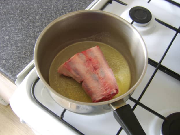 Browning the oxtail in butter and oil