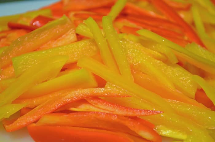 Yellow &amp; red peppers cut into strips