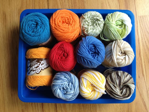 Select yarn colors for each planet. Use the planet color chart from the mini clay project above.