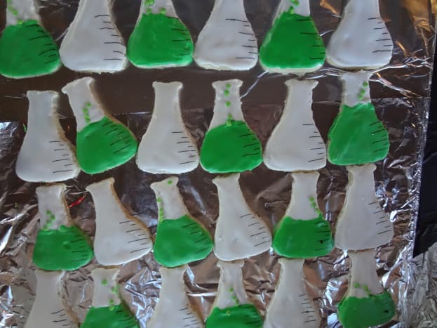 Beaker cookies with measuring lines and bubbling potions