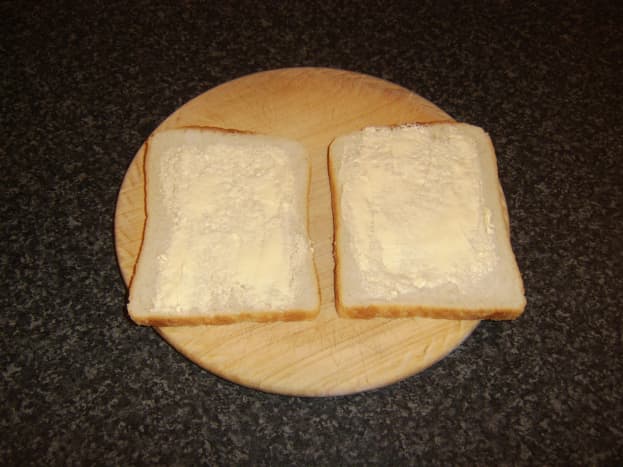 Bread slices are lightly buttered on one side only