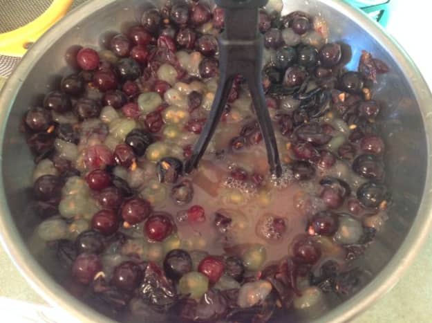 Start with clean grapes like you would for juice, and mash up completely.  Filter with a colandar or sieve.