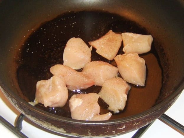 Frying chicken breast in olive oil
