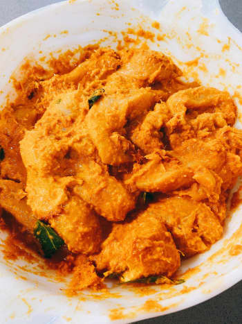 In a large bowl, combine the chicken and the paste. Add the spice mixture. Use your hand to incorporate the paste and the spice with the chicken.