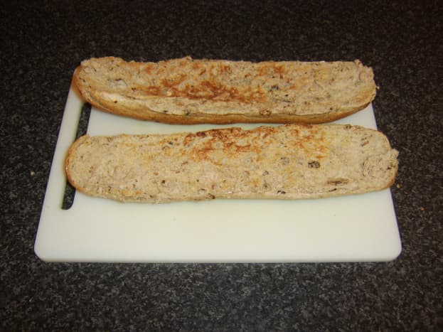 Bread stick is halved and lightly toasted