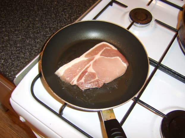 Pork chop is gently fried in oil