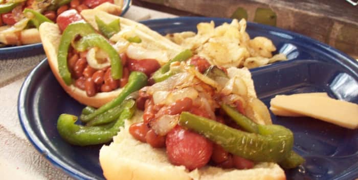 Chili hot dogs with peppers, onions and smoked Gouda cheese on the side.  