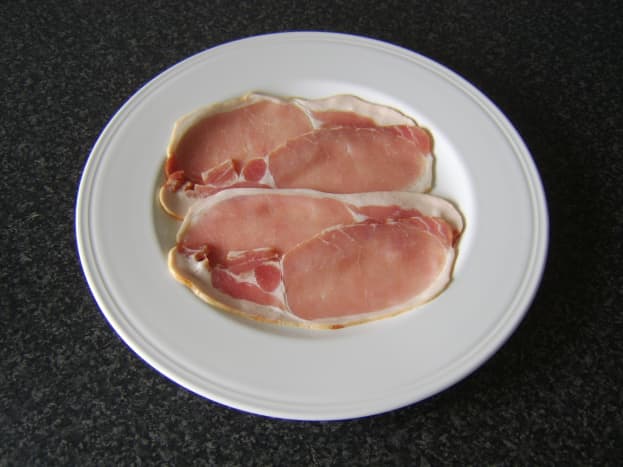 Bacon rashers are arranged on the pasty filling assembly plate