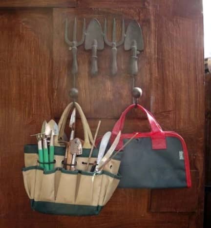 Decorative hooks on the inside of the door for hanging tool bags.