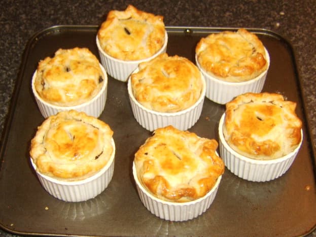 Mini haggis and clapshot puff pastry pies removed from oven