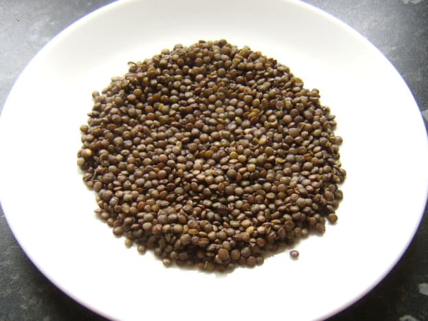 Lentils are laid on serving plates first