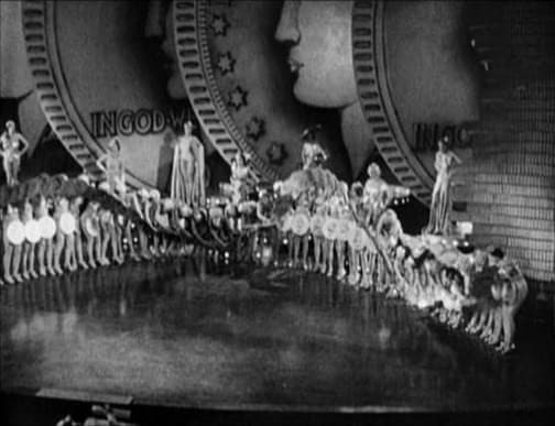 Gold Diggers of 1933 in the musical number &quot;Dance of the Dollars.&quot; The dancers are holding large coins and doing a &quot;wave.&quot;