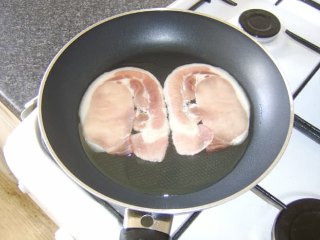 Middle bacon is put on to fry
