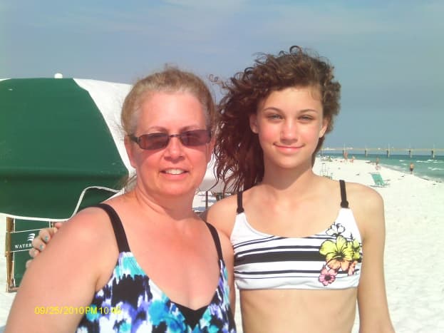 Grandmother and granddaughter enjoying beach time together.